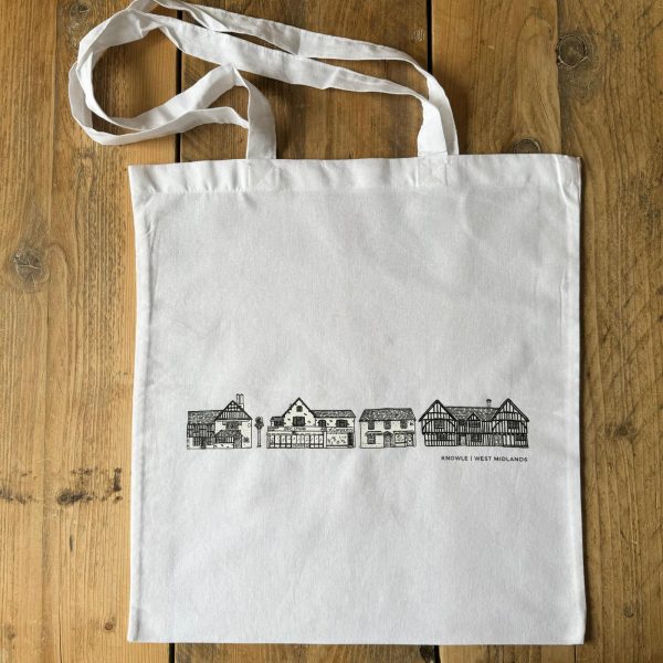 A white tote bag with black line drawings of distinctive buildings in Knowle