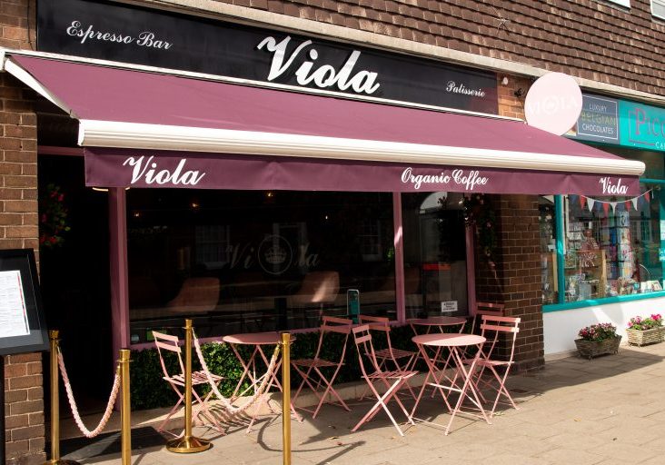 Outside of Viola Knowle, with outdoor seating underneath a canopy